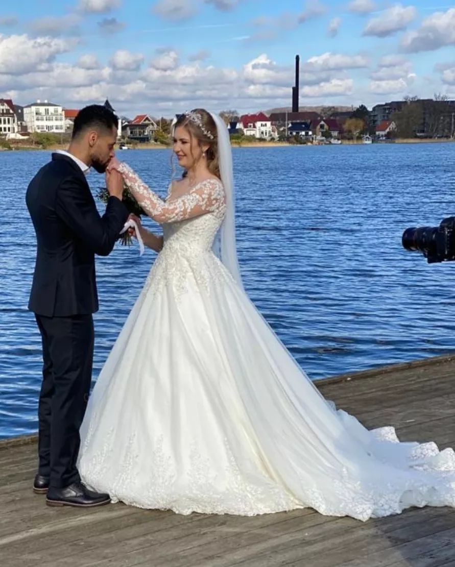 A-Line Sweetheart Bridal Gown with Long Sleeves and Lace Appliques