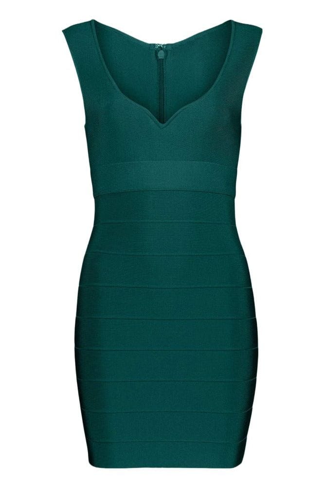 Woman wearing a figure flattering  Josie Bandage V Neck Mini Dress - Emerald Green BODYCON COLLECTION